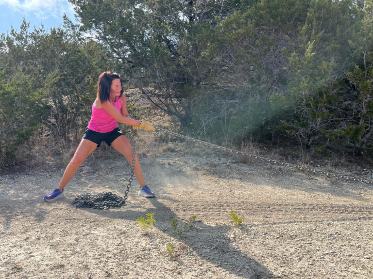 Woman in pink enjoying fitness programs in San Antonio.